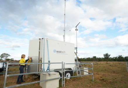 Scientist opening door to air monitoring station
