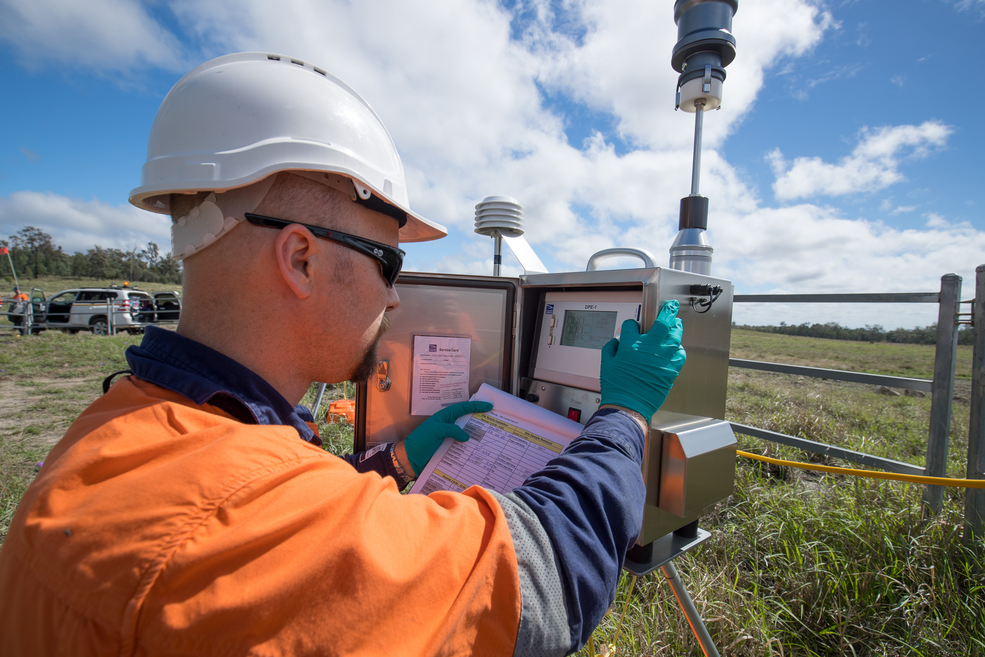 Researcher James Harnwell sampling air quality in a gas field at gas field, Reedy Creek, QLD