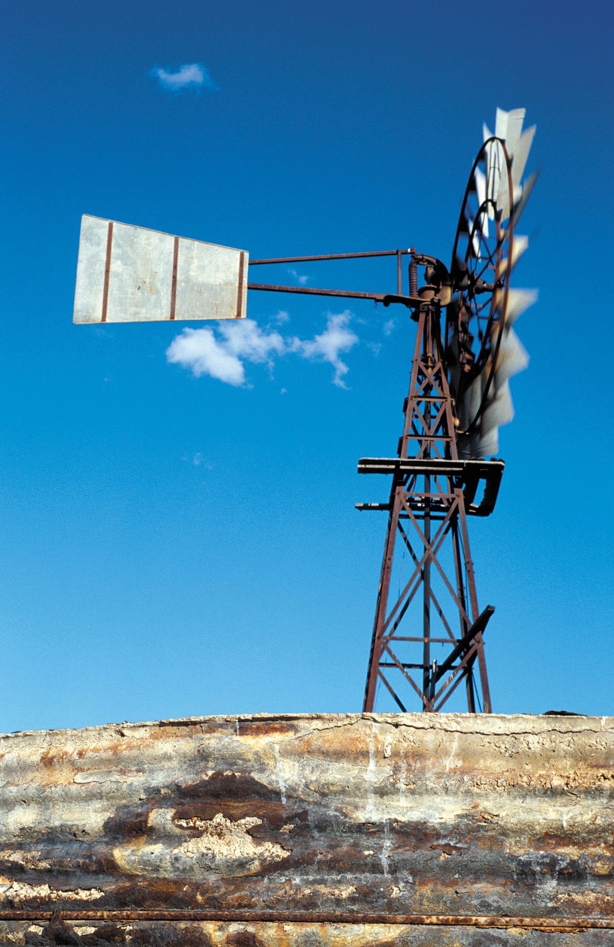 Windmill and corroding water tank near Balfes Creek, QLD.