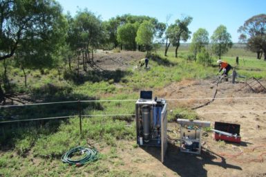Researchers using portable analyser in field in SA